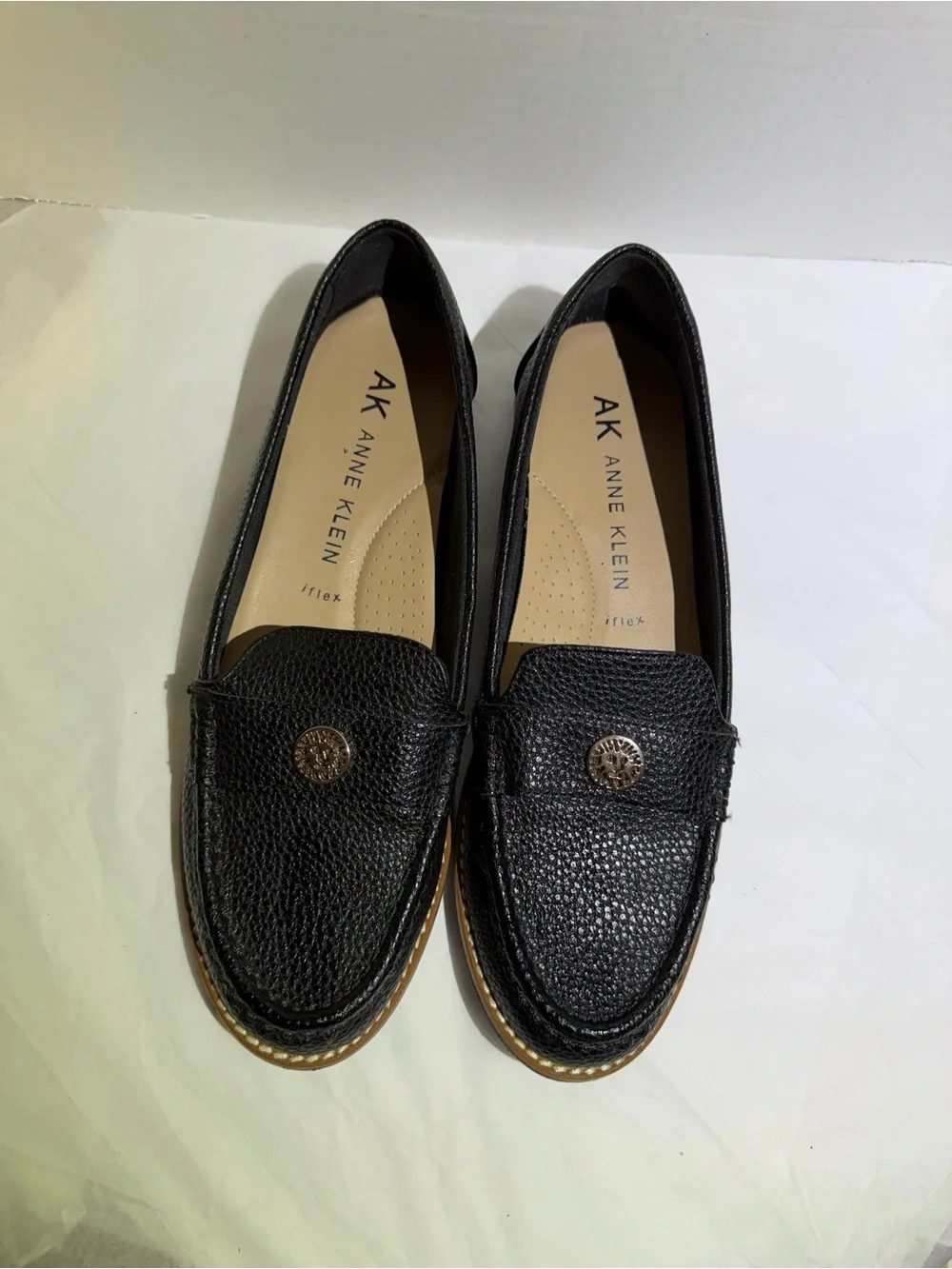 Anne Klein Black Textured Leather Loafers with Gold Emblem